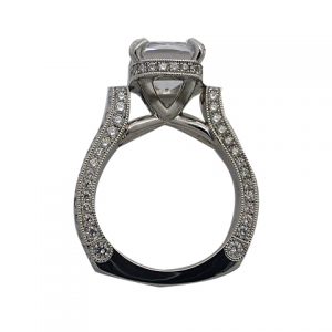 platinum round brilliant diamond cathedral style engagement ring with a hidden halo hand engraved