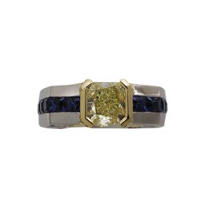 modified radiant cut yellow diamond half-bezel platinum in 18kt gold men's ring with princess cut sapphires