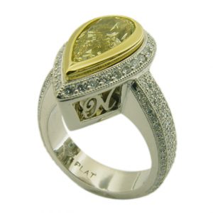 18kt yellow gold pear shaped yellow diamond halo engagement ring with pave diamonds