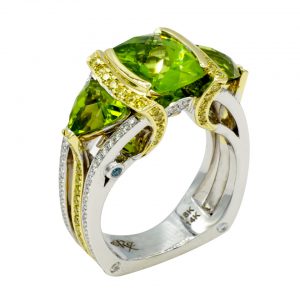 fancy cut checkerboard peridot 18kt and 14kt two-tone ring accented with yellow diamonds and white diamonds