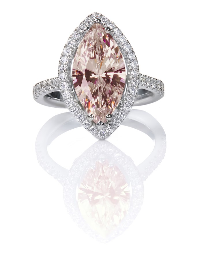 Peach Pink Morganite Beautiful Diamond Engagment ring. Gemstone Marquise cut surrounded by a halo of diamonds.